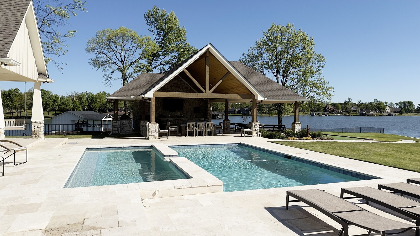 inground-pool-design-modern-backyard-with-patio-and-lake-view
