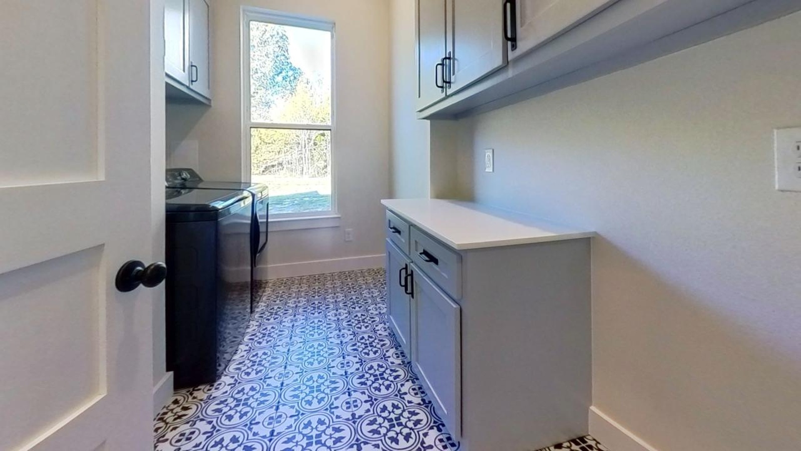 modern house design modern laundry room with decorative tile floor | GPS: 33.582588, -94.691754