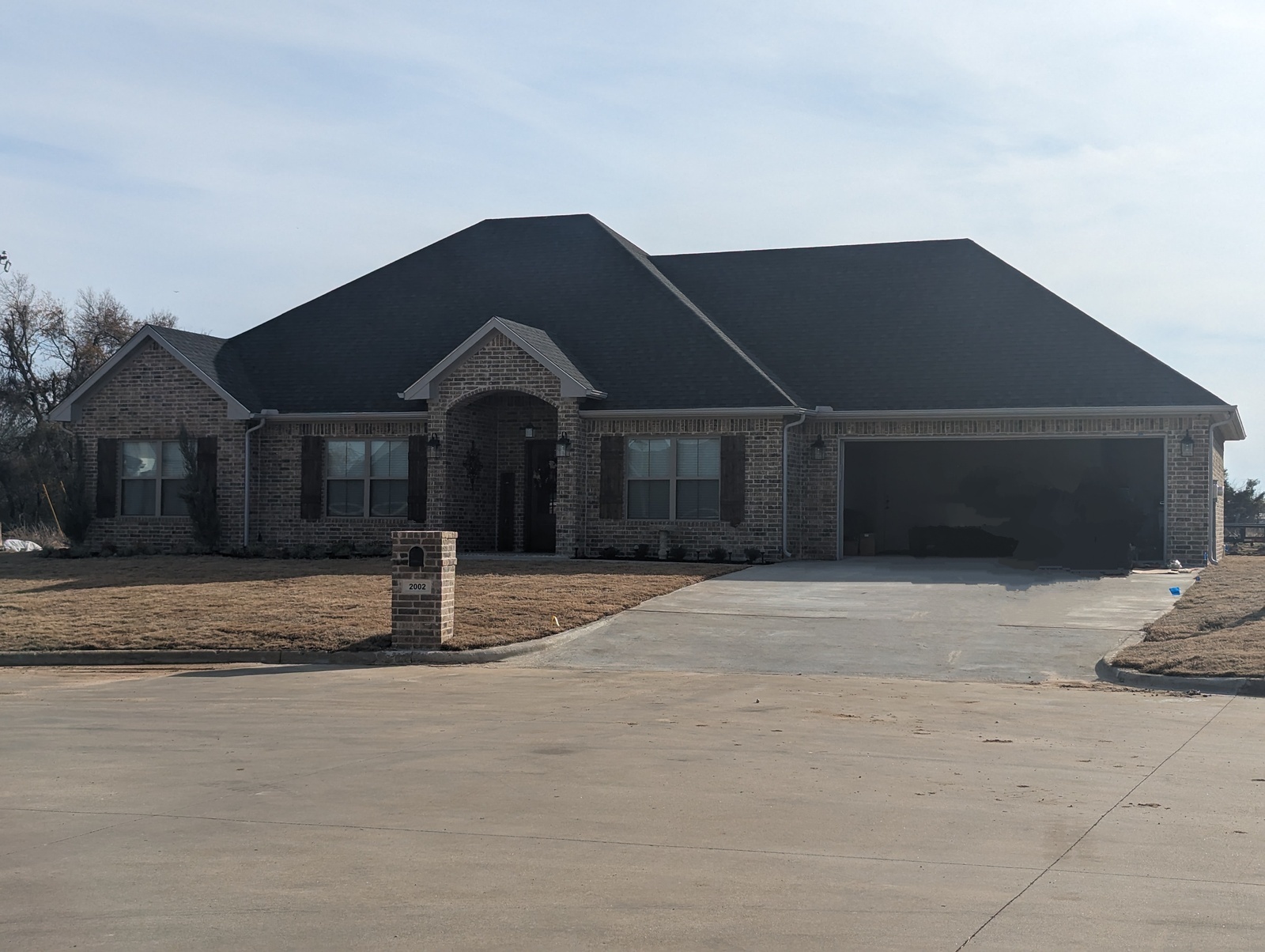 new builds in my area modern brick house with garage and yard | GPS: 33.355860, -94.961699