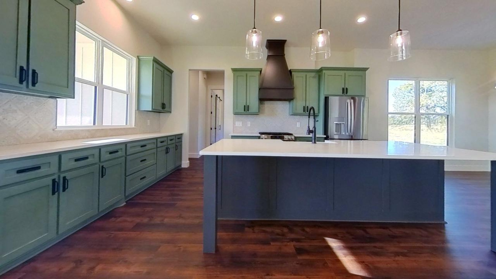 new modern kitchen with green cabinets residential construction | GPS: 32.995549, -95.390687