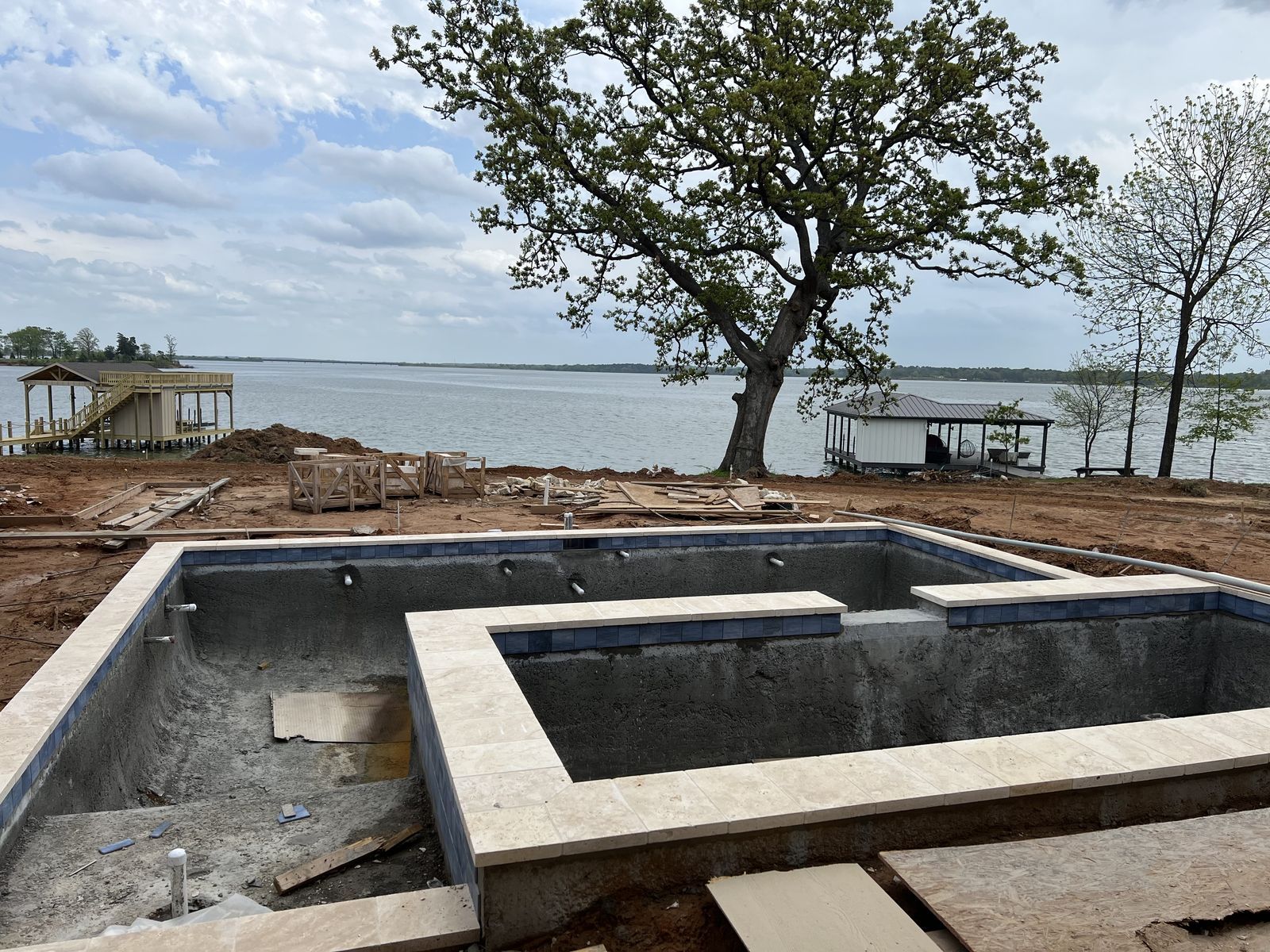 new-pool-construction-with-water-features-and-lake-view